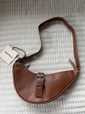 REVOLVE- superdown Cognac Crescent Shoulder Bag with Buckle Accent